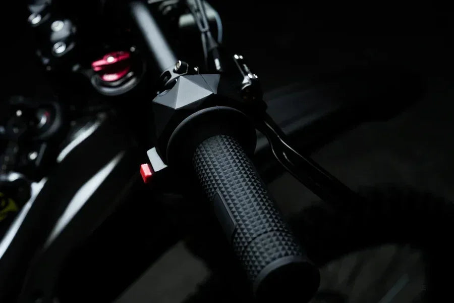 Close-up of 79BIKE Falcon Pro Electric Dirt Bicycle handlebar with dark background
