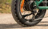 Close-up of a Engwe EP-2 3.0 Boost Electric motorcycle wheel with a focus on the tire and chain.