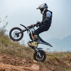Person performing a wheelie on a KuKirin X1 Electric Scooter Motorcycle in an outdoor setting