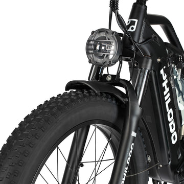 Close-up of a black PHILODO Jumbo Dual Motor Electric Bike with visible branding on a white background