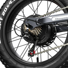 Close-up of a bicycle wheel with chain and gear system on a white background