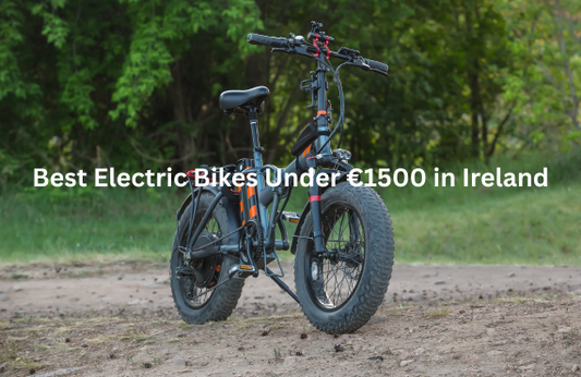 foldable electric bike with fat tires in black and orange, side view on dirt path outdoors